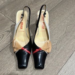Miu Miu Kitten heal with pointy square front in red, tan, grey, and black.